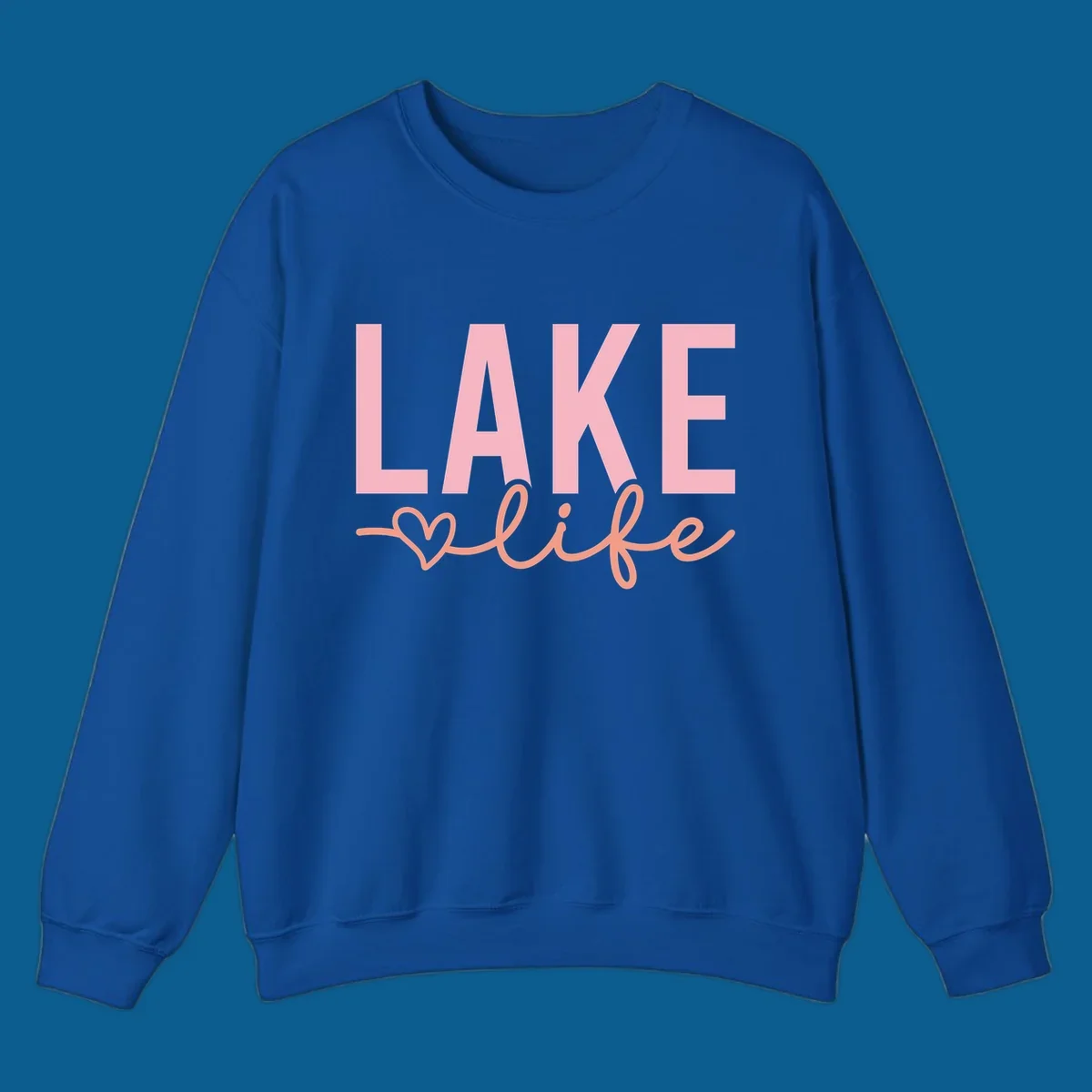 Lake life script design with pink letters and peach cursive text with a heart. lake-life-script