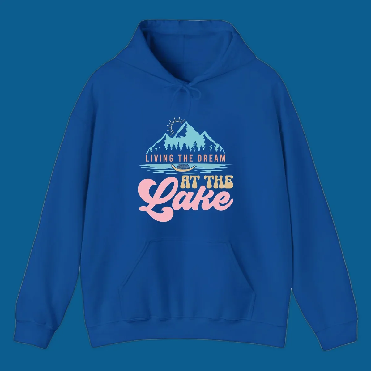 Illustration of mountains and lake with text 'Living The Dream At The Lake', representing the lake-life-dream concept.