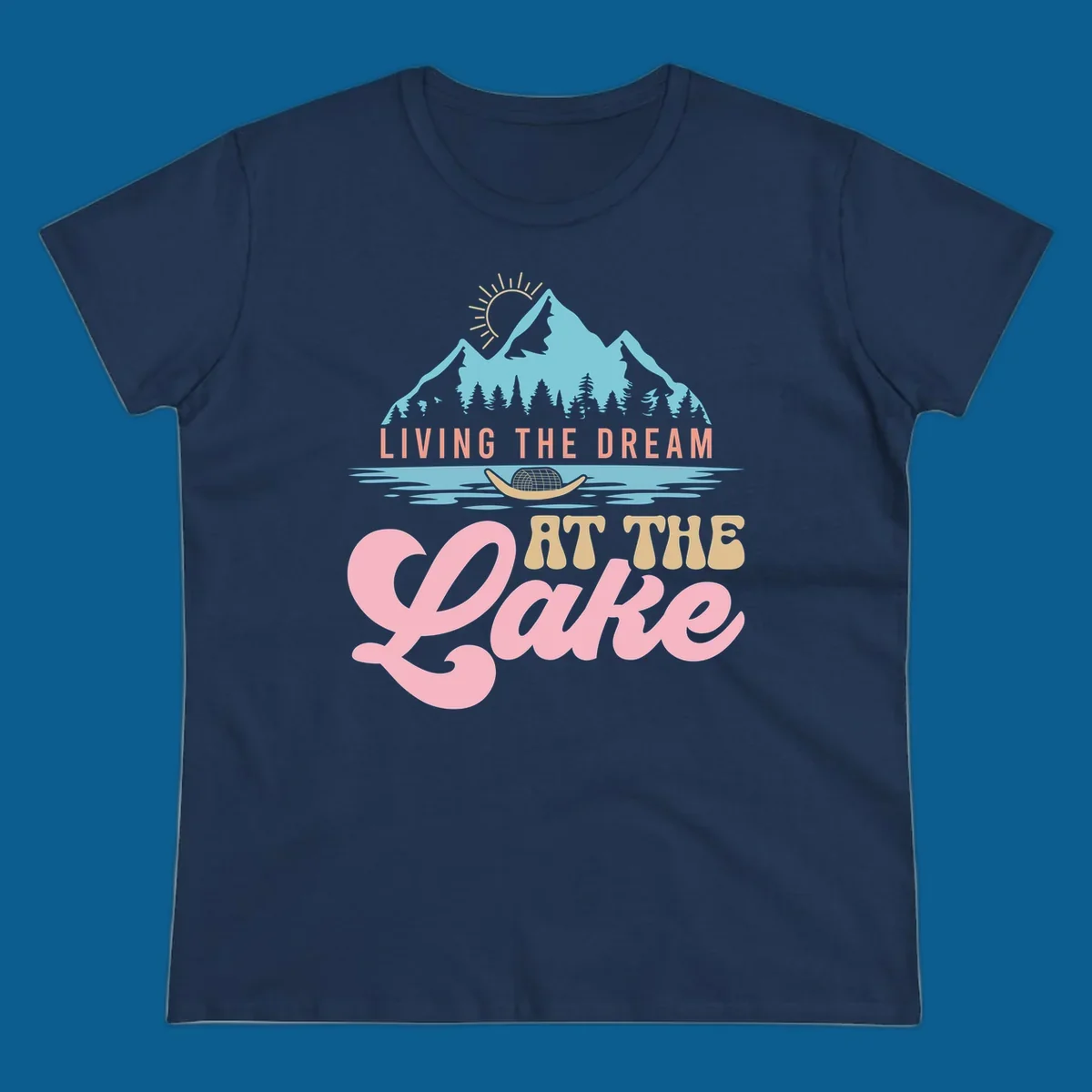 Illustration of mountains and lake with text 'Living The Dream At The Lake', representing the lake-life-dream concept.