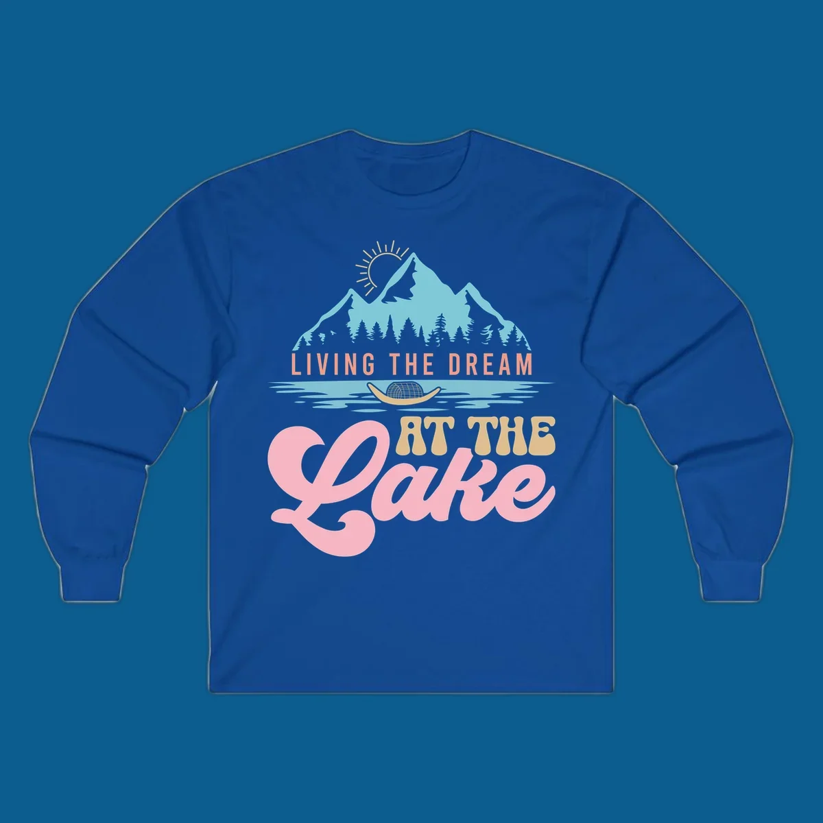 Illustration of mountains and lake with text 'Living The Dream At The Lake', representing the lake-life-dream concept.