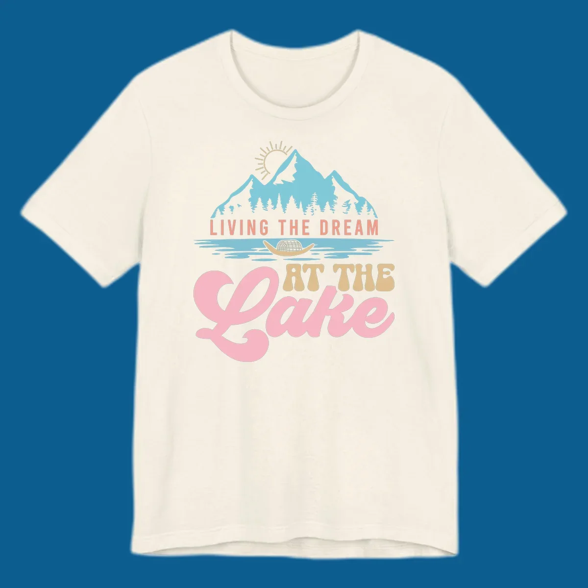 Illustration of mountains and lake with text 'Living The Dream At The Lake', representing the lake-life-dream concept.