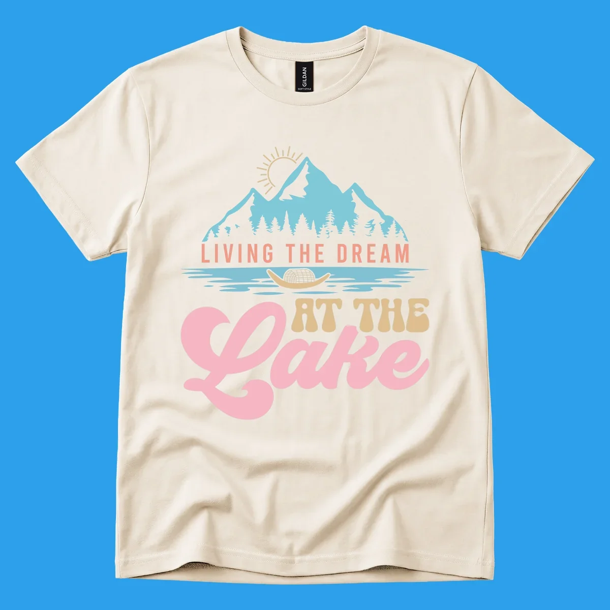 Illustration of mountains and lake with text 'Living The Dream At The Lake', representing the lake-life-dream concept.