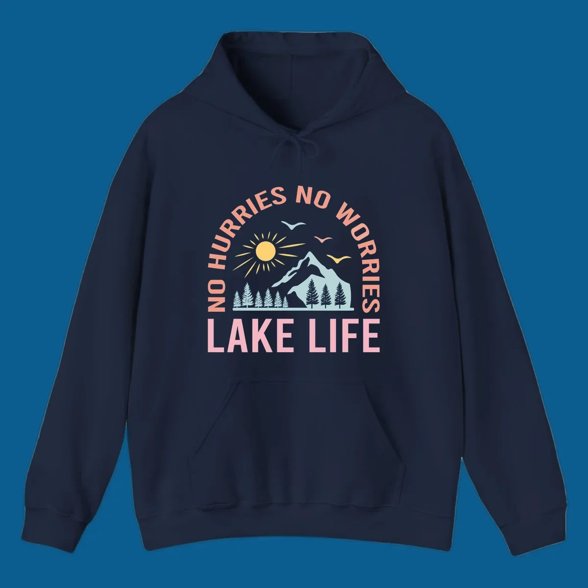 Lake life scenic design with mountains, sun, trees, and no worries text.