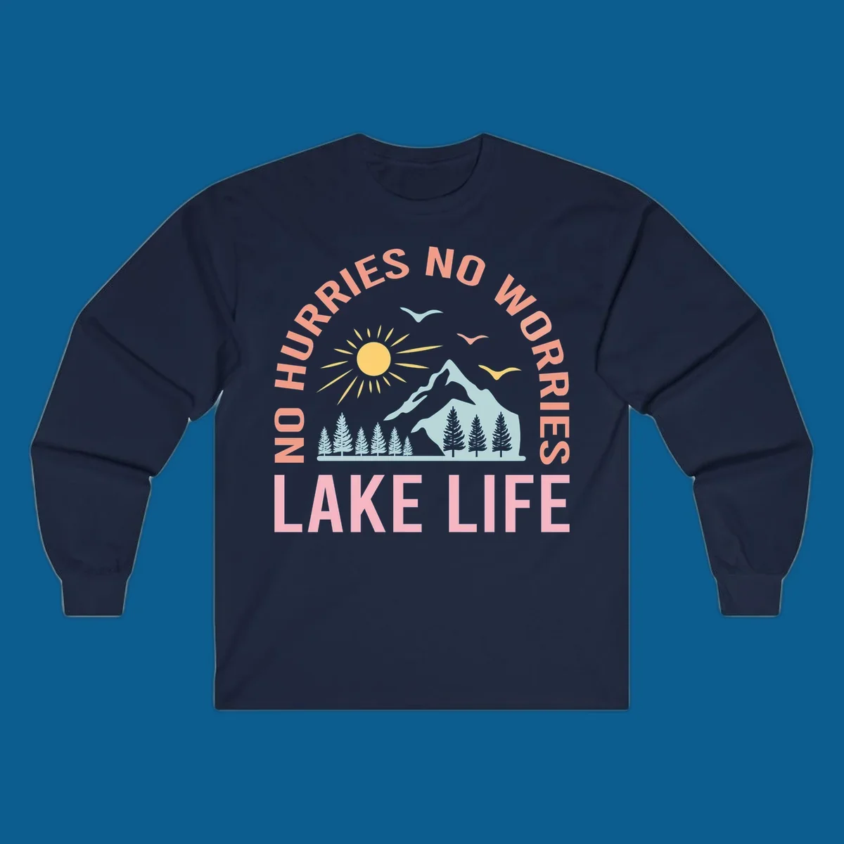 Lake life scenic design with mountains, sun, trees, and no worries text.