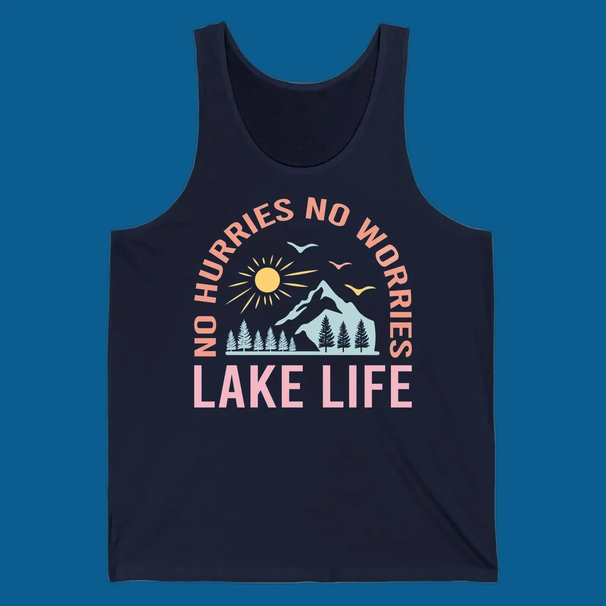 Lake life scenic design with mountains, sun, trees, and no worries text.