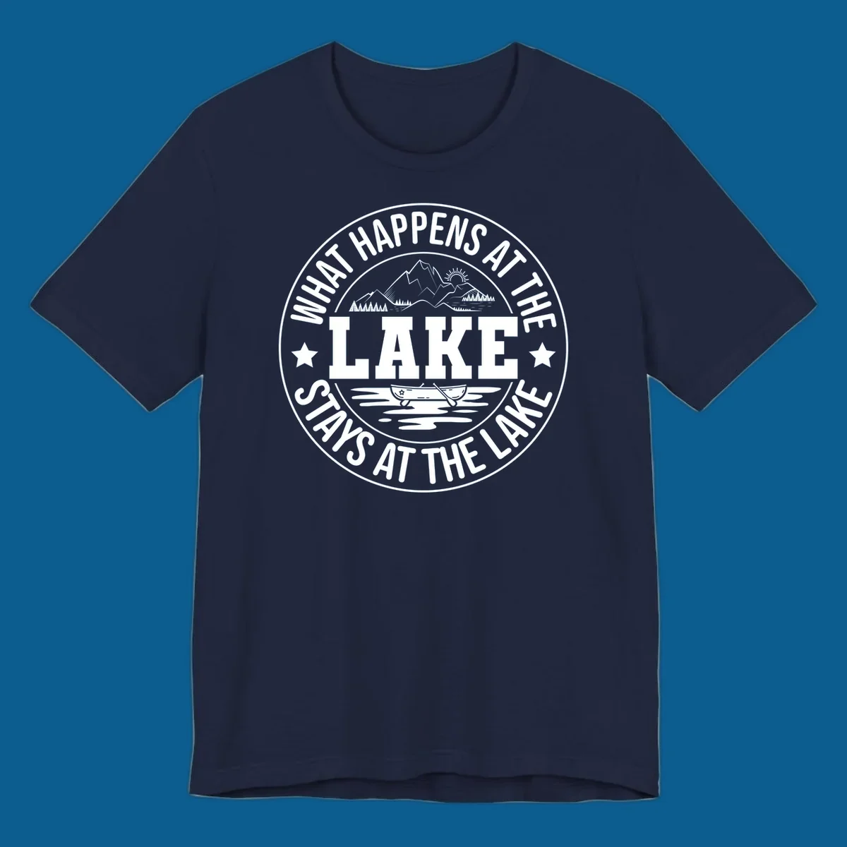 Circular badge with text 'What Happens At The Lake Stays At The Lake' and lake scene graphic.