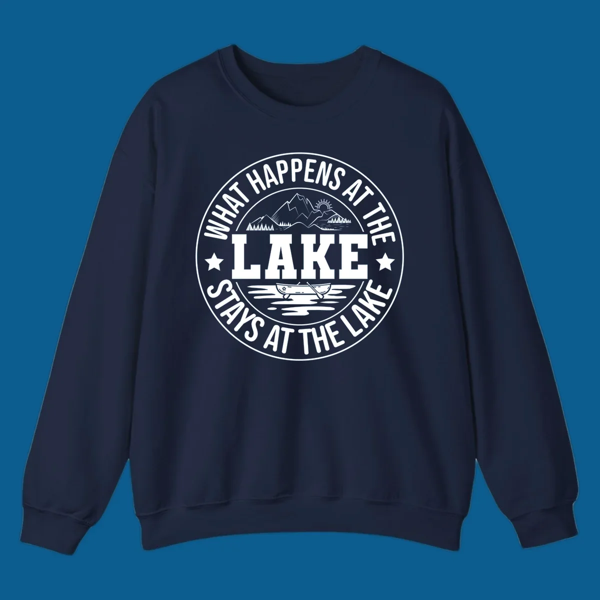 Circular badge with text 'What Happens At The Lake Stays At The Lake' and lake scene graphic.