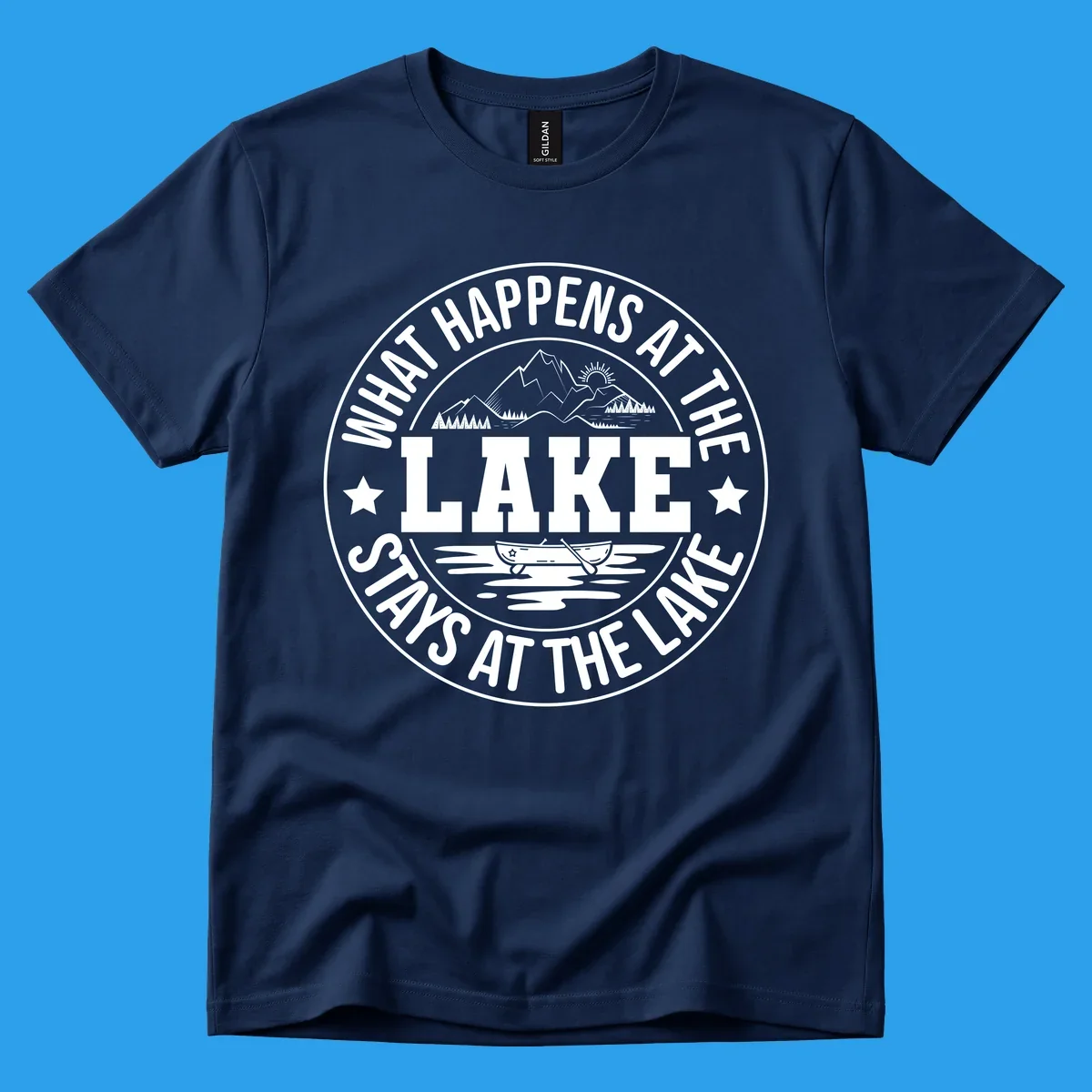 Circular badge with text 'What Happens At The Lake Stays At The Lake' and lake scene graphic.