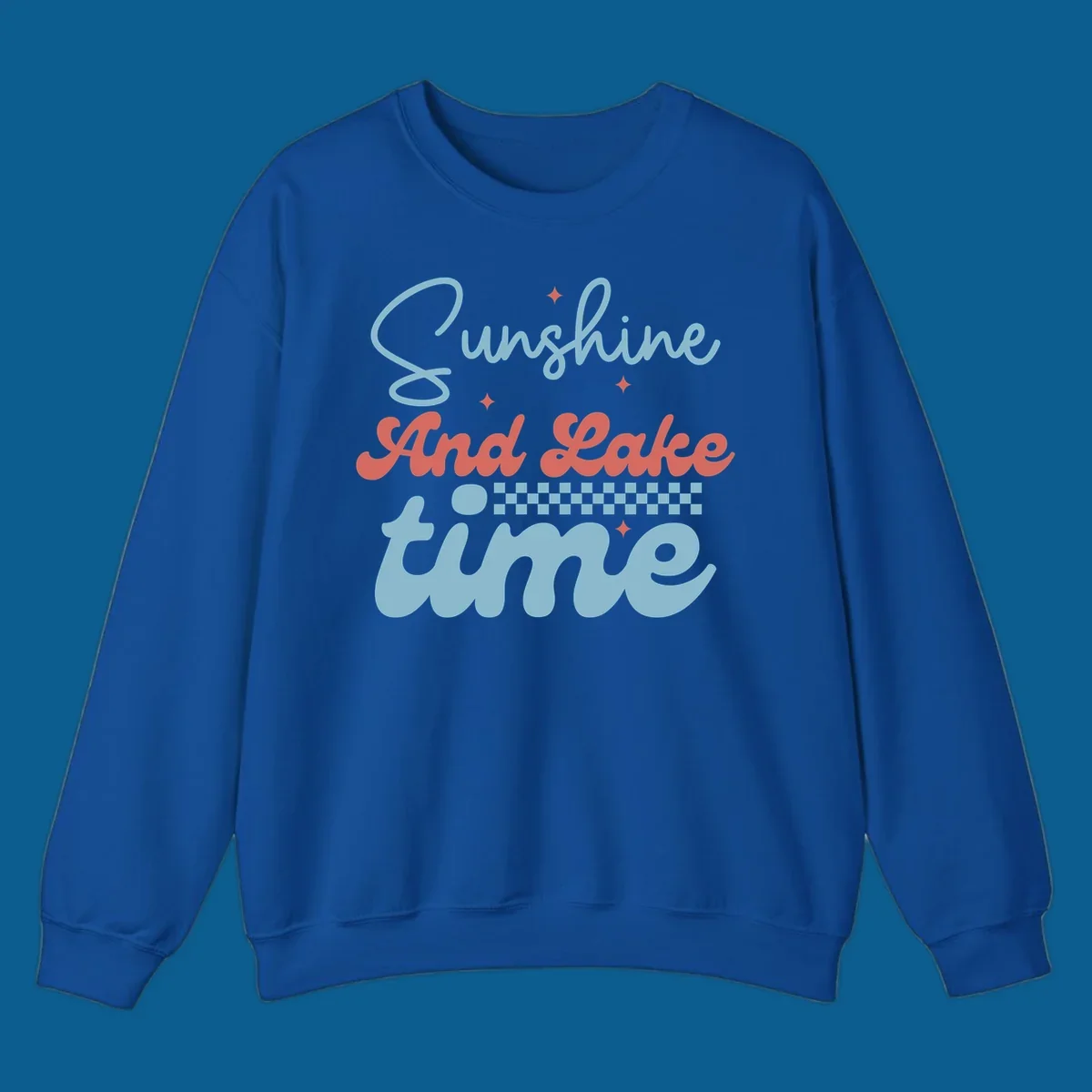 Retro sunshine and lake time text design with sparkle accents and checkerboard pattern.