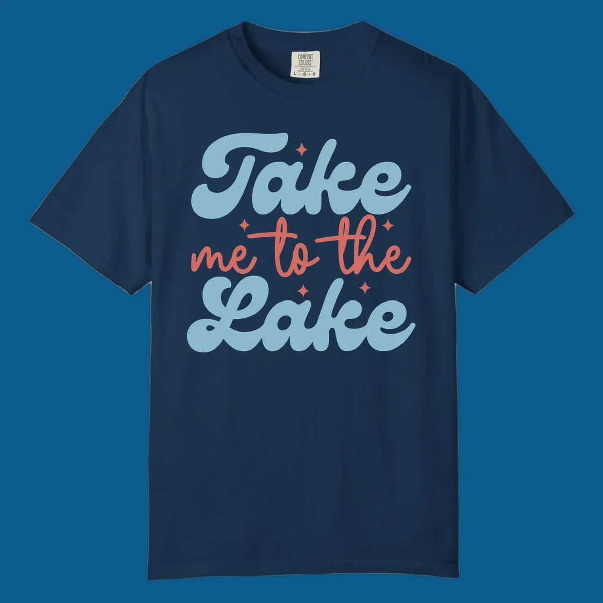 Retro 'Take me to the lake' text design with blue and coral lettering and white starbursts.