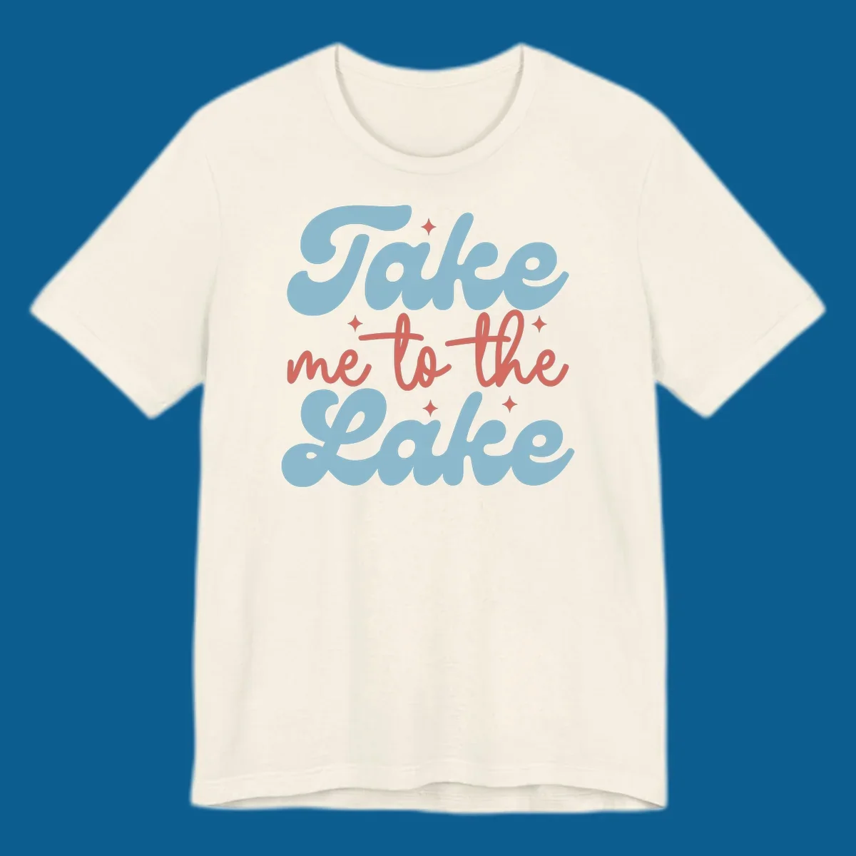 Retro 'Take me to the lake' text design with blue and coral lettering and white starbursts.