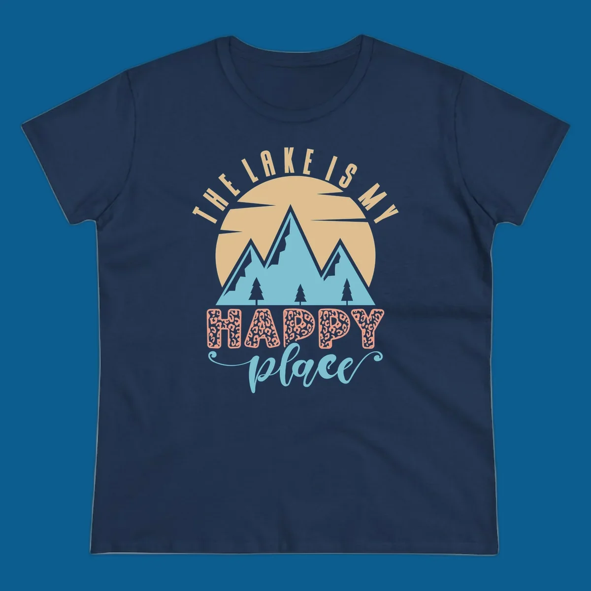 Illustration of mountains and sun with text 'The Lake Is My Happy Place' and leopard print.