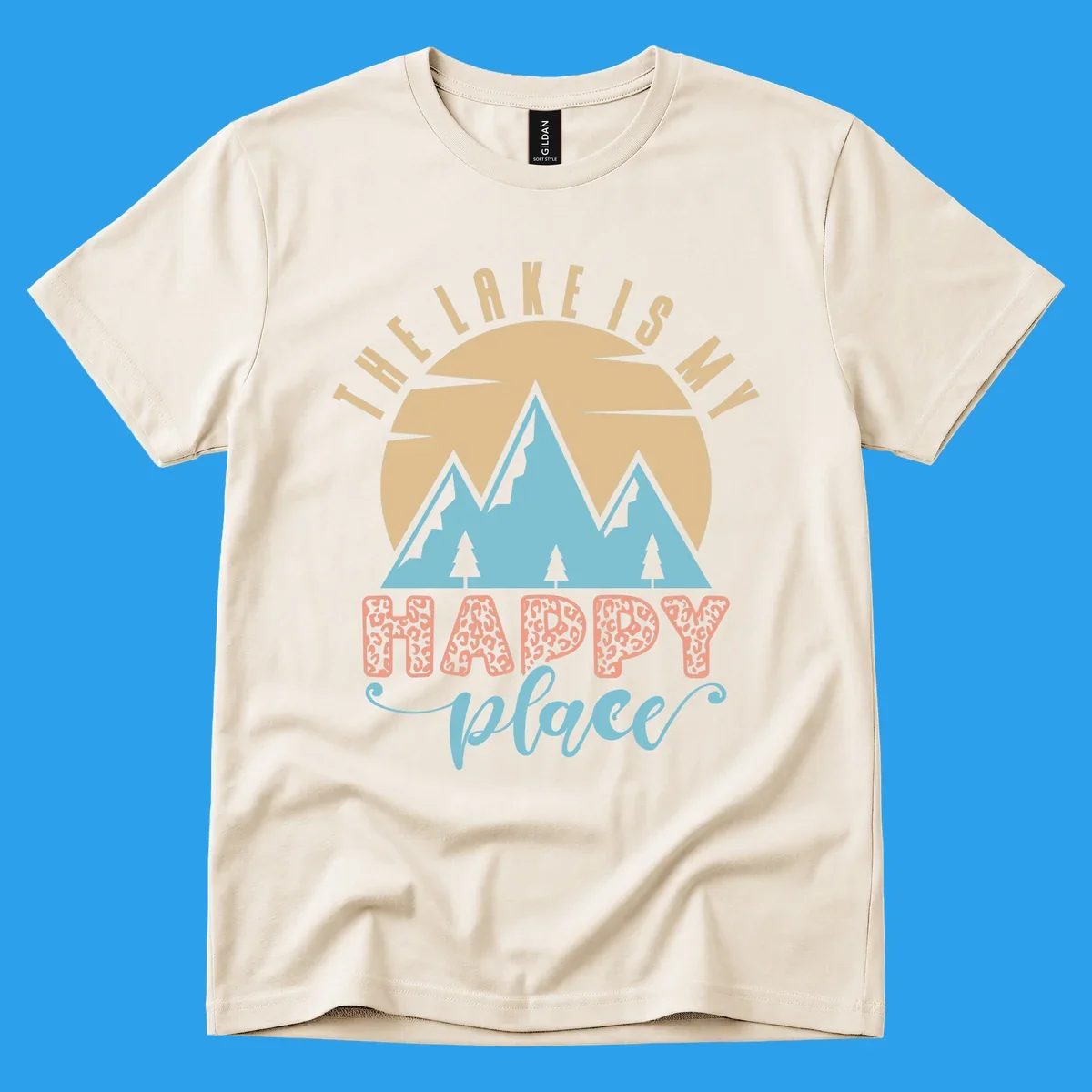 Illustration of mountains and sun with text 'The Lake Is My Happy Place' and leopard print.