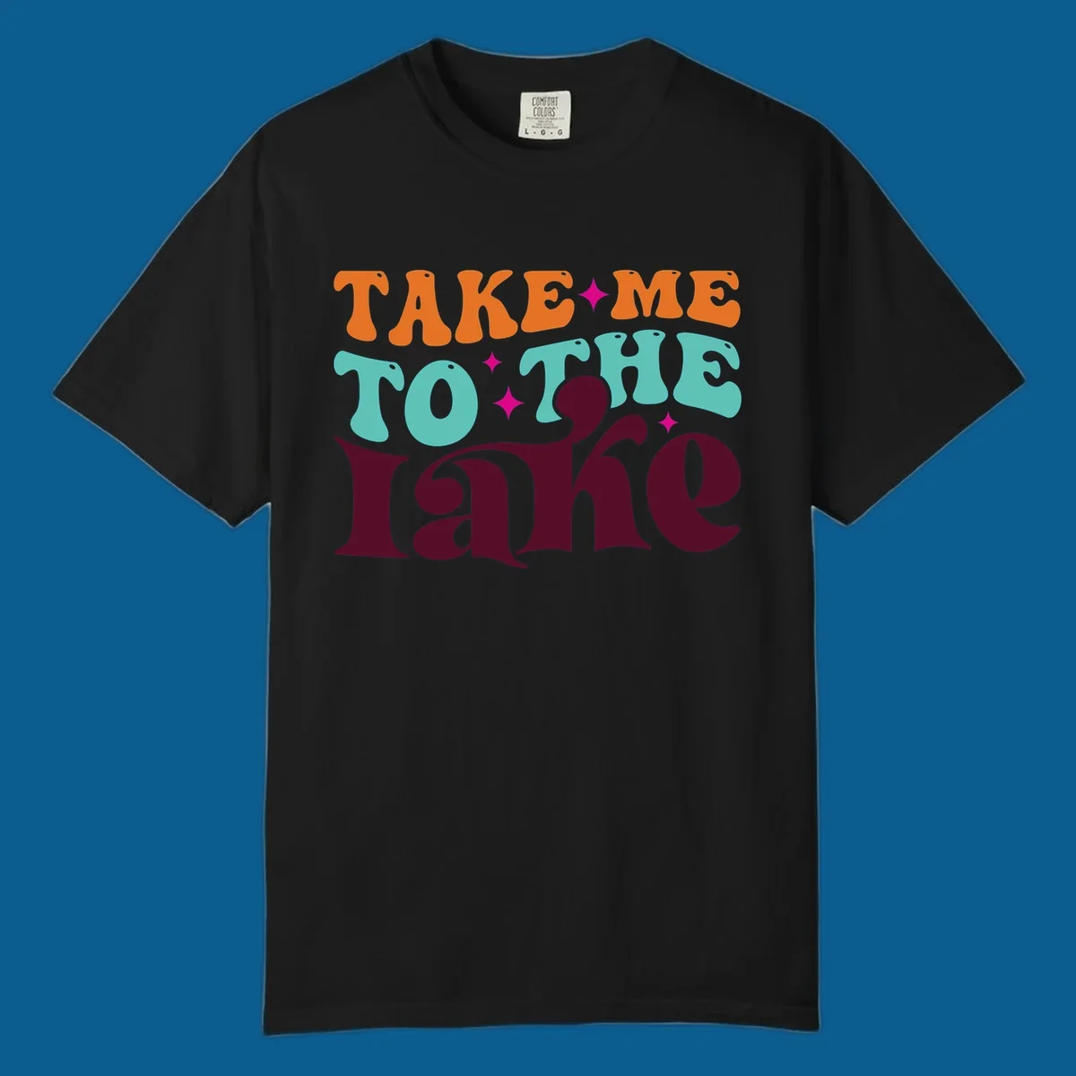 Retro typography design with the phrase 'TAKE ME TO THE lake' in orange, teal, and purple.