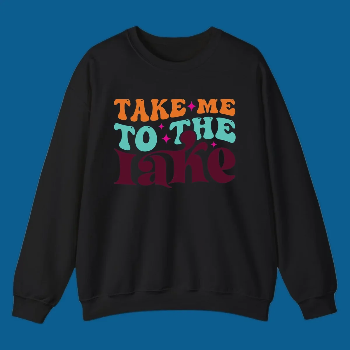 Retro typography design with the phrase 'TAKE ME TO THE lake' in orange, teal, and purple.