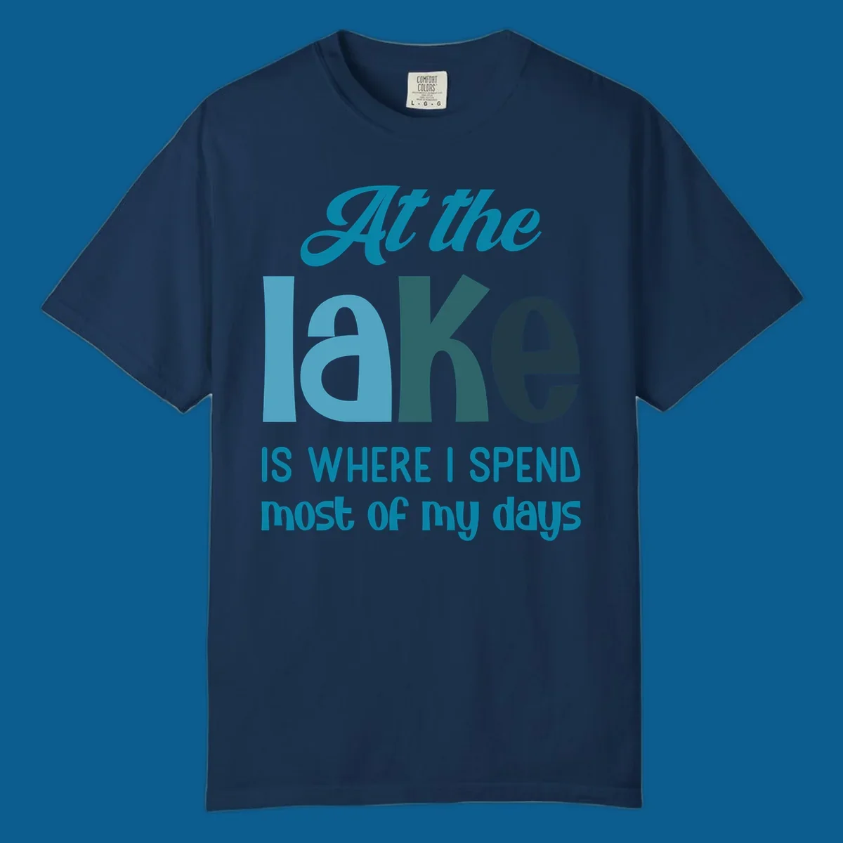Typography design with the phrase "At the lake is where I spend most of my days".