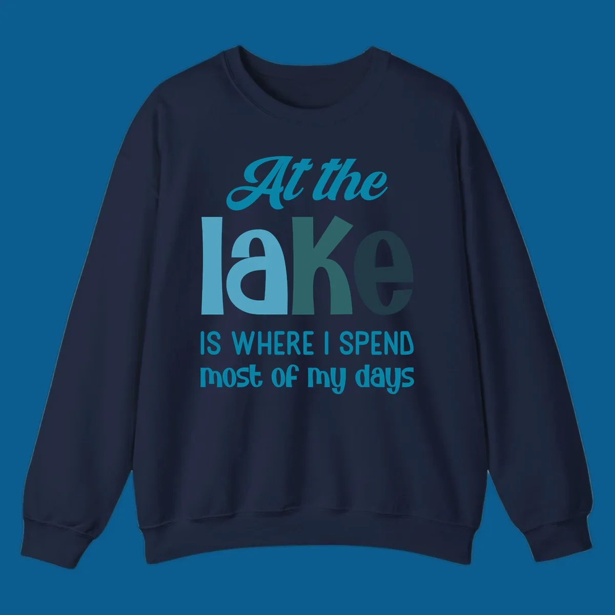 Typography design with the phrase "At the lake is where I spend most of my days".