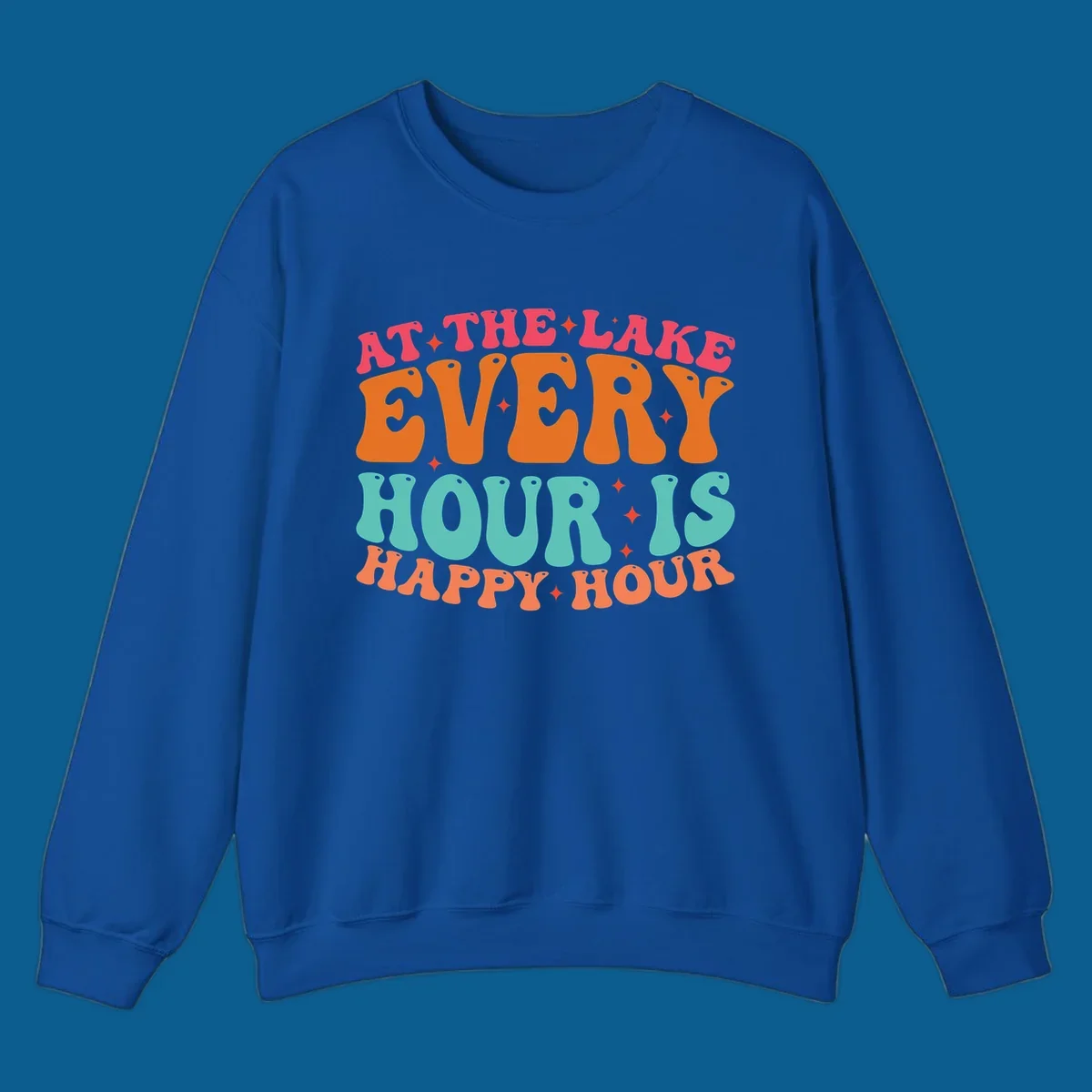 Retro text design that says "AT THE LAKE EVERY HOUR IS HAPPY HOUR" with starbursts, lake happy hour concept.