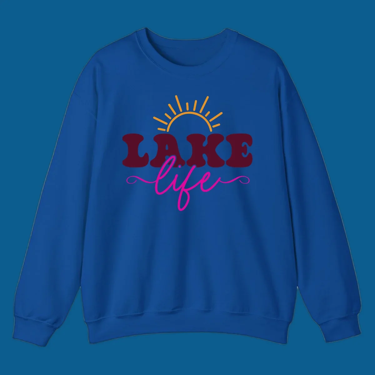 Retro lake life sun graphic with maroon LAKE and pink life text.