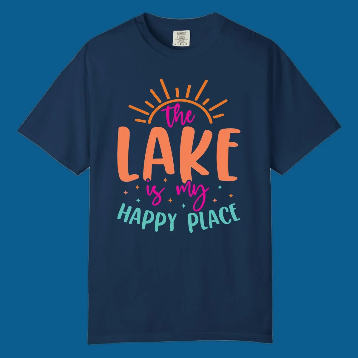 The lake is my happy place text design with sun rays and stars.
