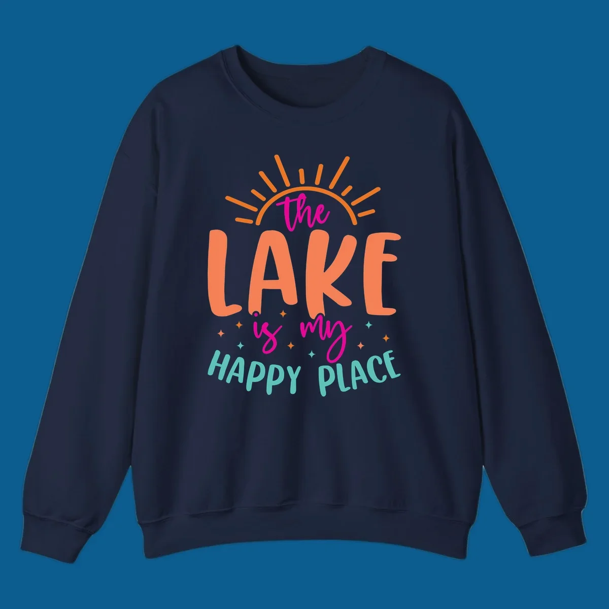 The lake is my happy place text design with sun rays and stars.