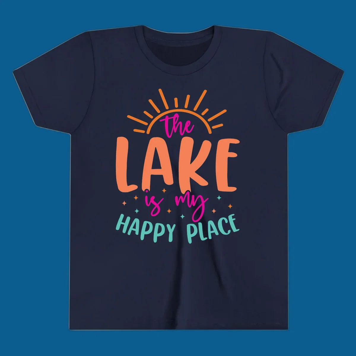 The lake is my happy place text design with sun rays and stars.