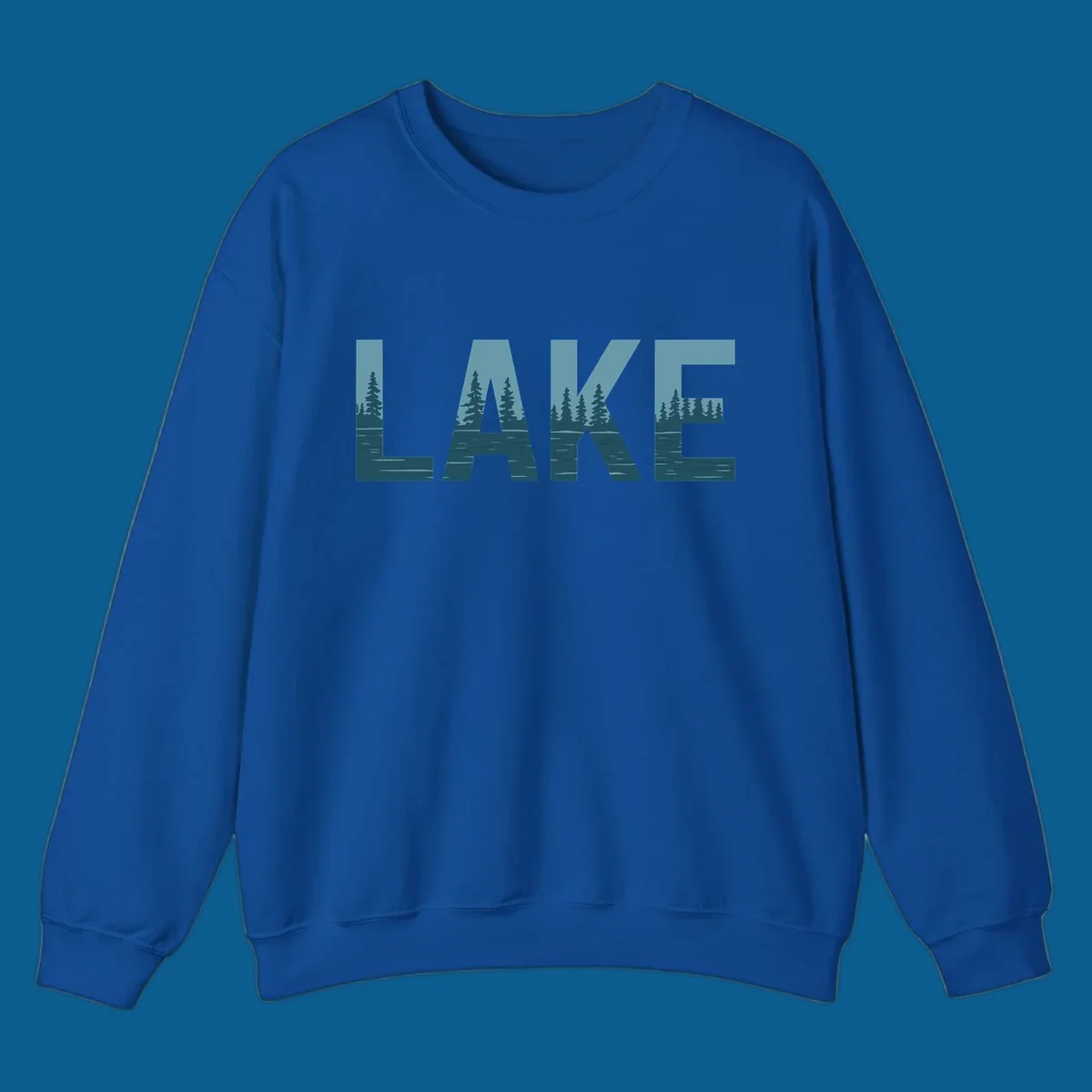 The word LAKE filled with a pine tree and lake water landscape. lake-pine-trees.