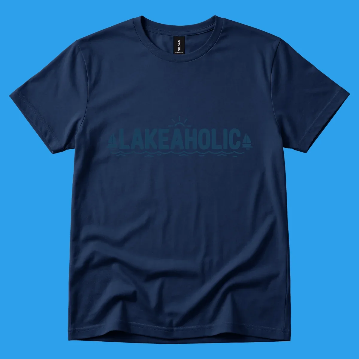 Lakeaholic typography with sun, sailboats, and waves graphic.