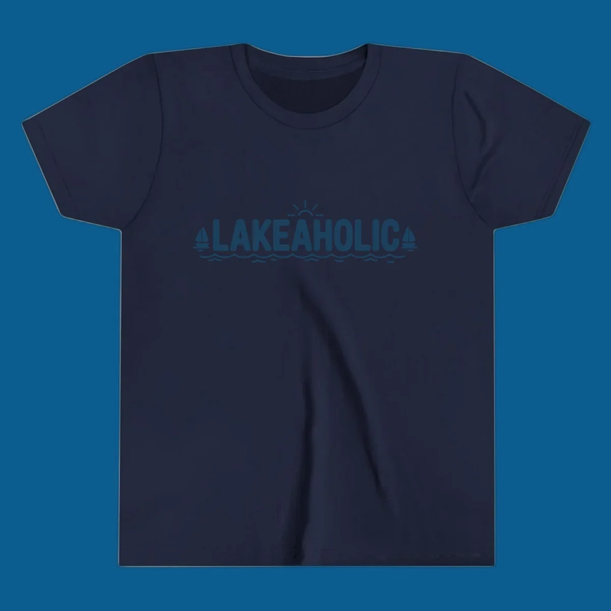 Lakeaholic typography with sun, sailboats, and waves graphic.
