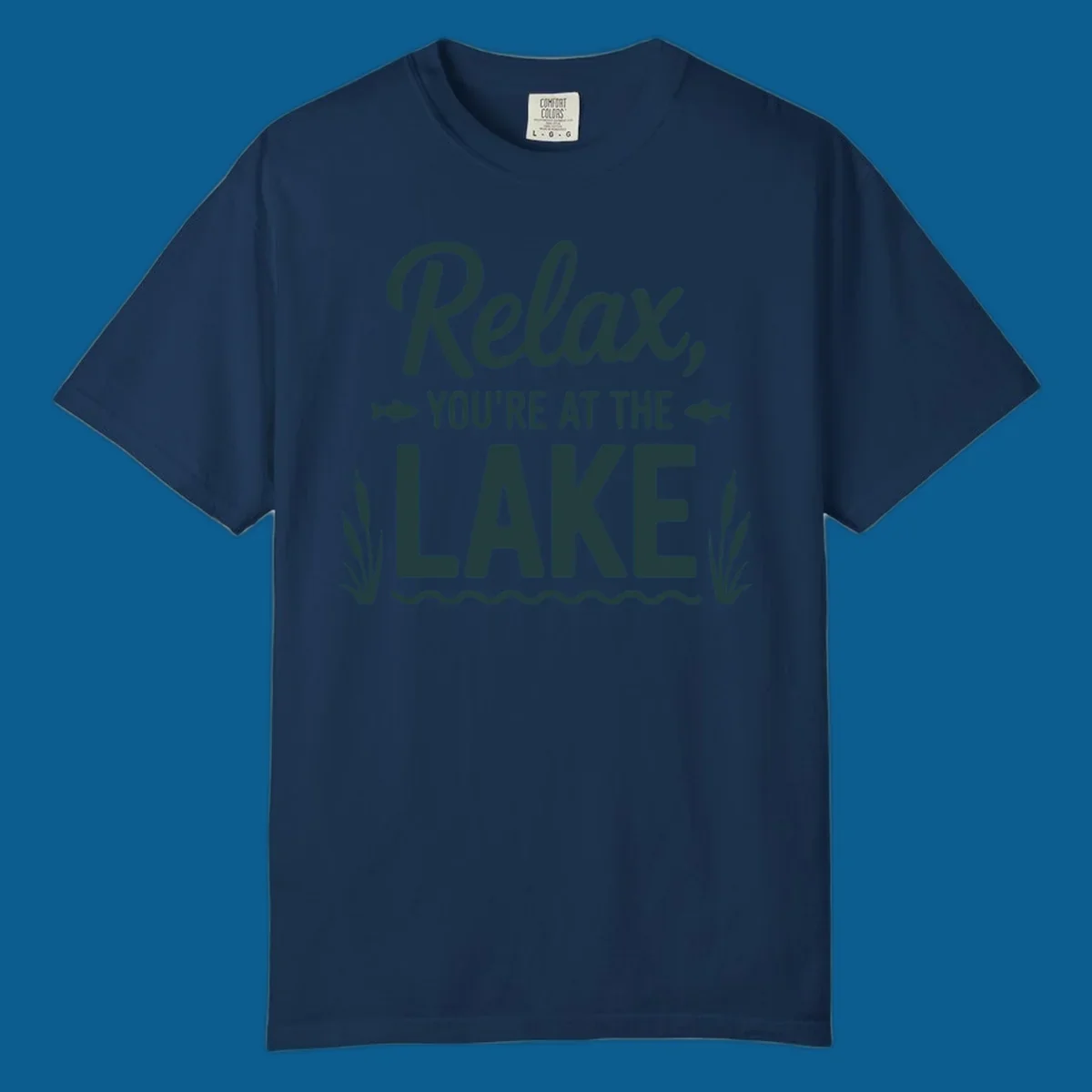 Relax you're at the lake typographic design with fish and cattails.