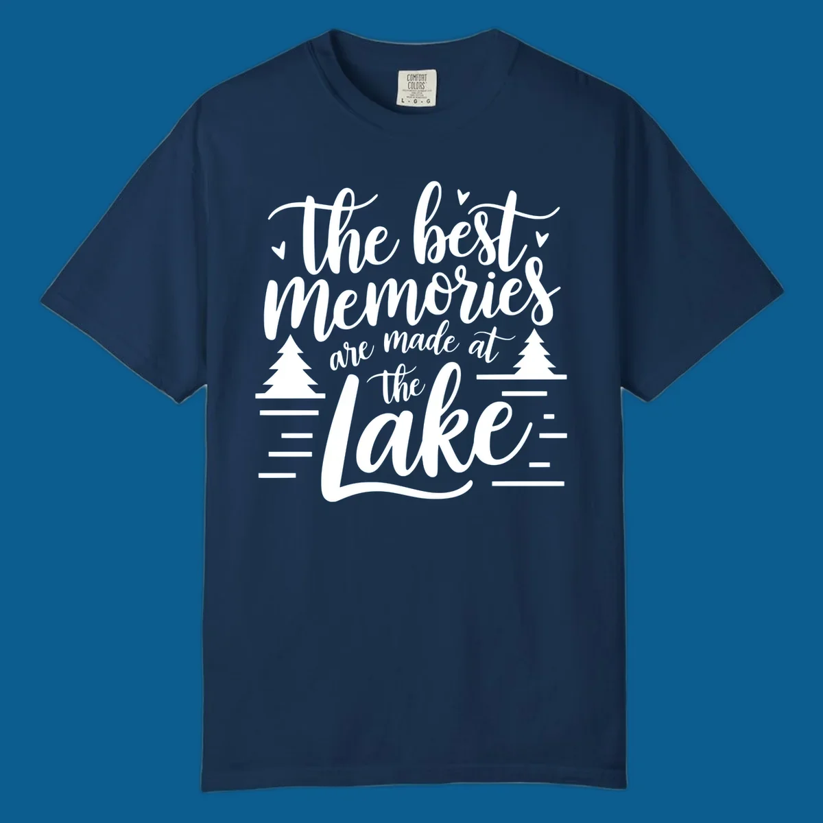 The best memories are made at the lake text with trees and water lines for lake life memories.