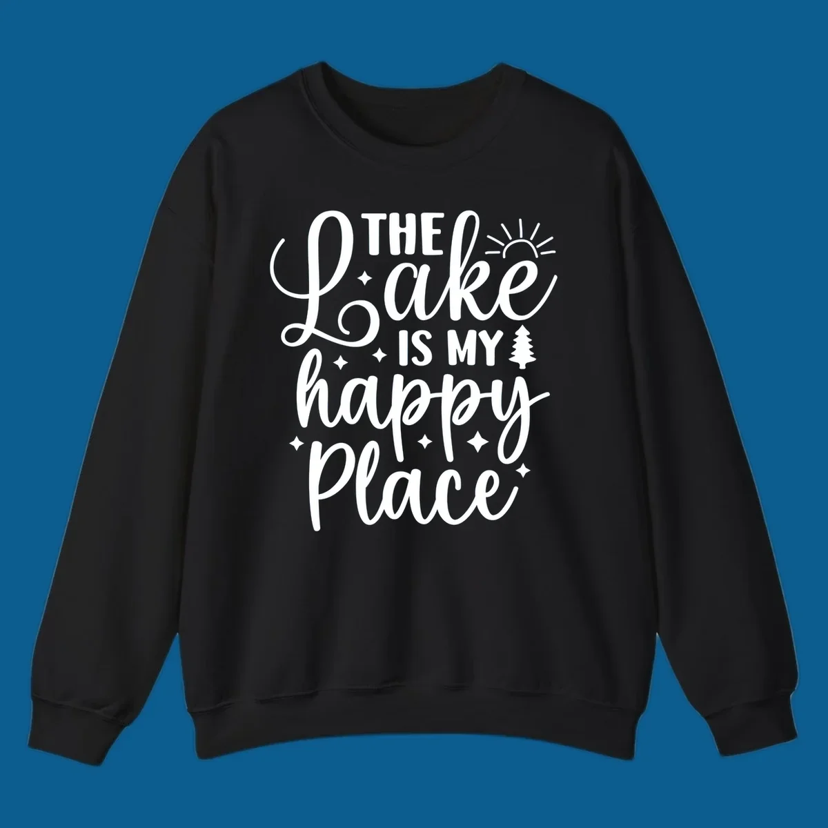 The Lake Is My Happy Place text and graphic design with sun, stars, and tree.