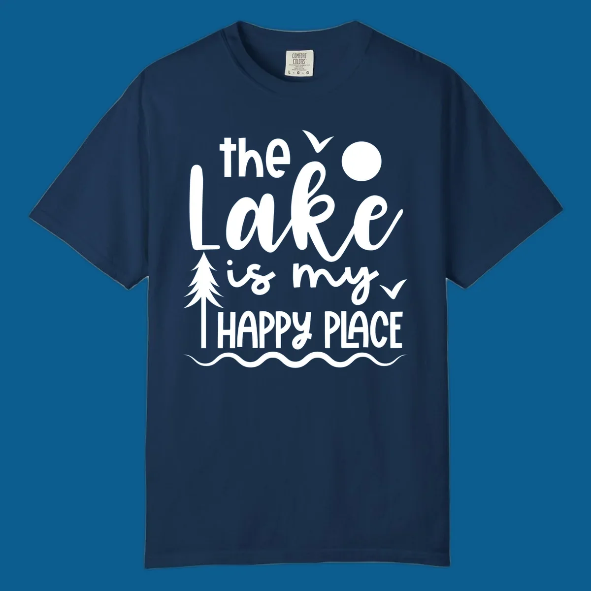 The Lake Is My Happy Place text design with lake elements like a tree, sun, and birds.
