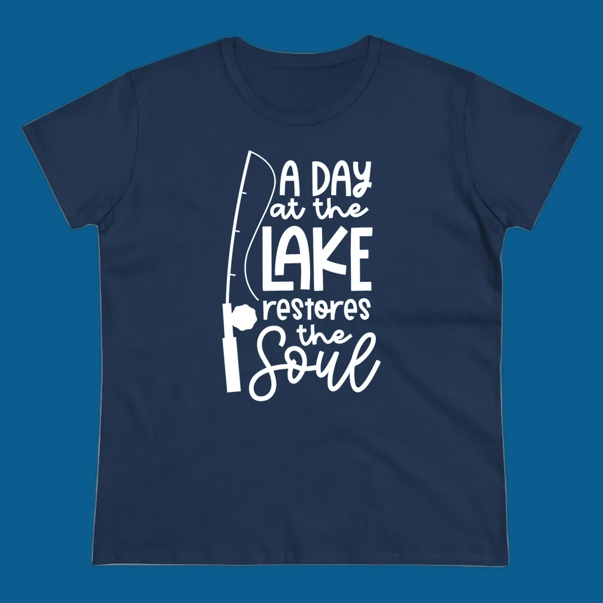 Fishing pole with text "A Day at the Lake Restores the Soul", lake-life concept.