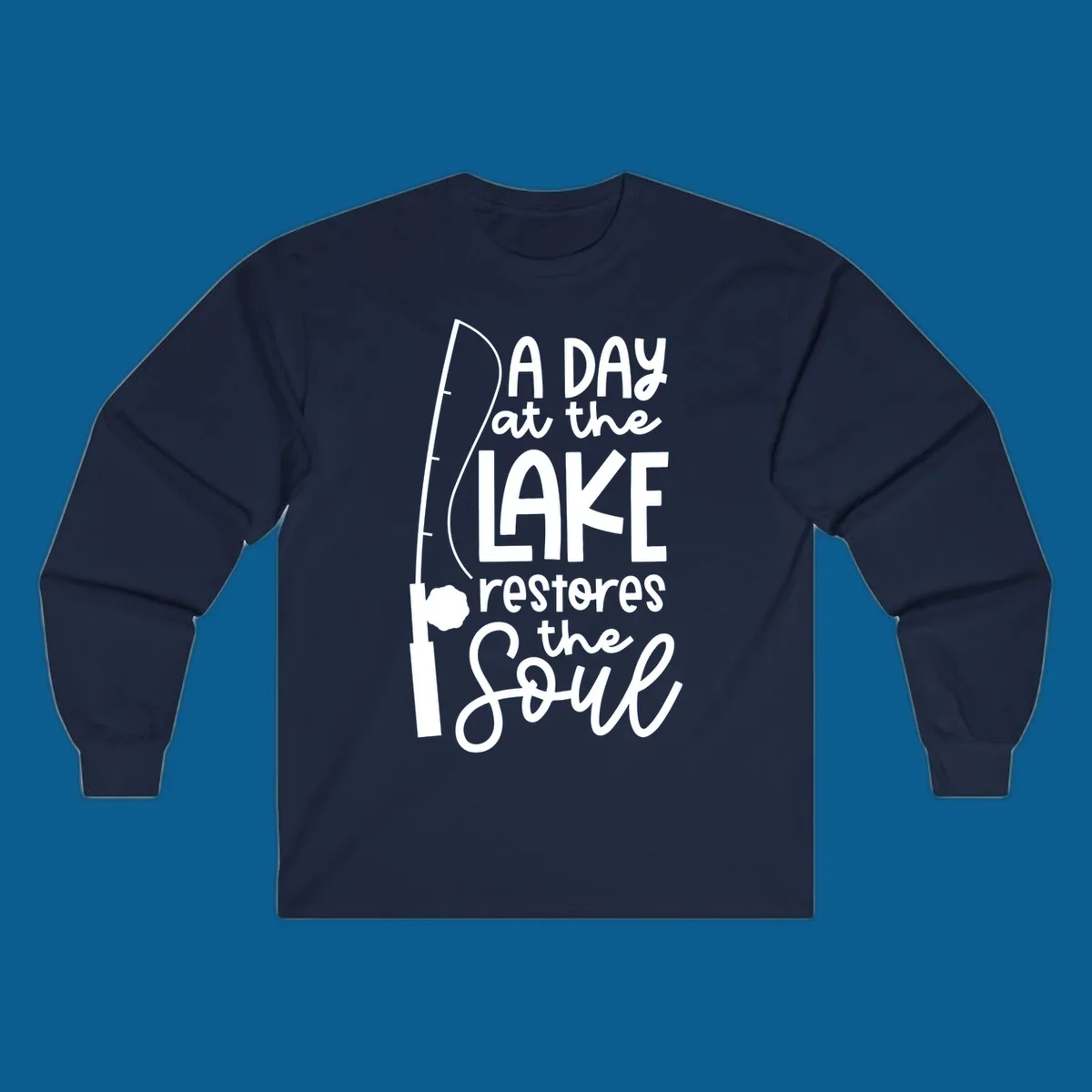 Fishing pole with text "A Day at the Lake Restores the Soul", lake-life concept.