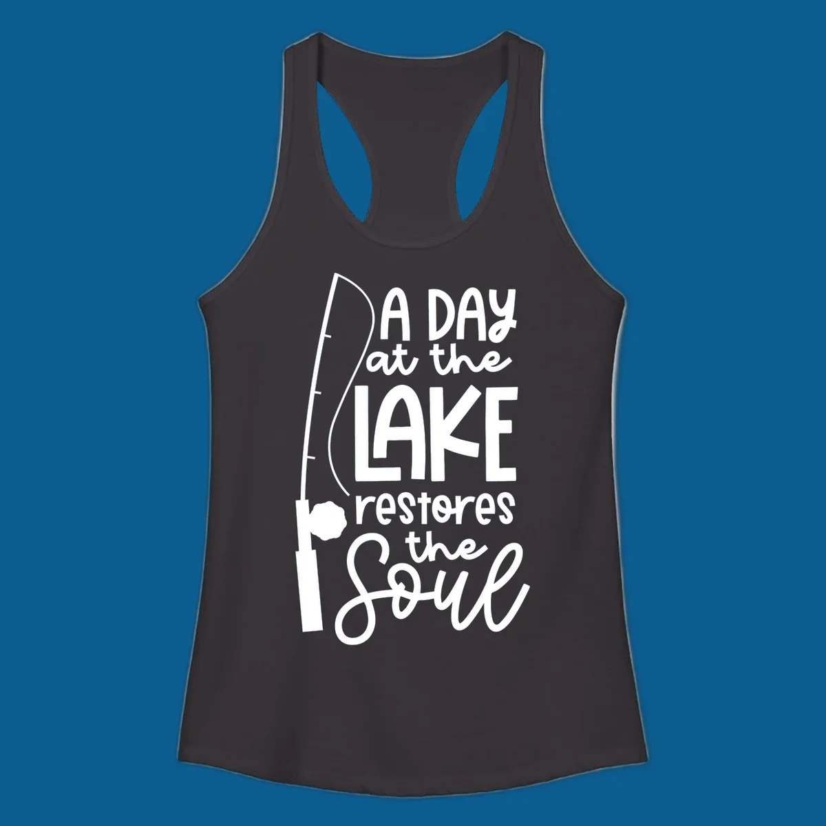 Fishing pole with text "A Day at the Lake Restores the Soul", lake-life concept.
