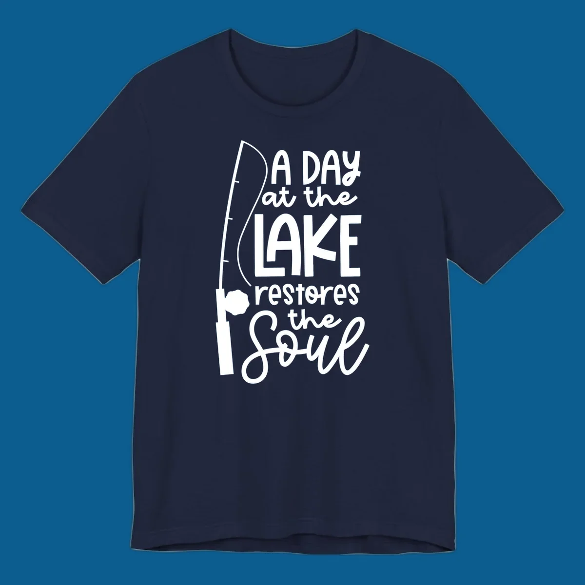 Fishing pole with text "A Day at the Lake Restores the Soul", lake-life concept.