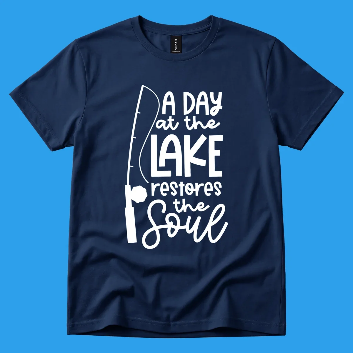 Fishing pole with text "A Day at the Lake Restores the Soul", lake-life concept.