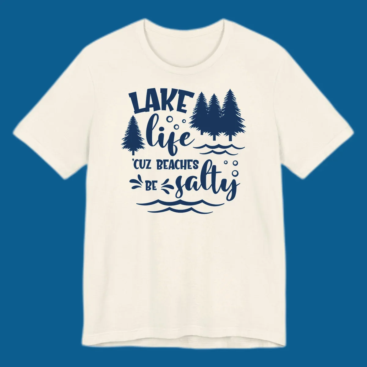 Lake life graphic with text 'LAKE life 'CUZ BEACHES BE salty', pine trees, and water waves.