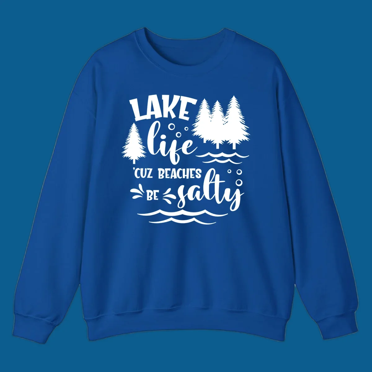 Lake life graphic with text 'LAKE life 'CUZ BEACHES BE salty', pine trees, and water waves.