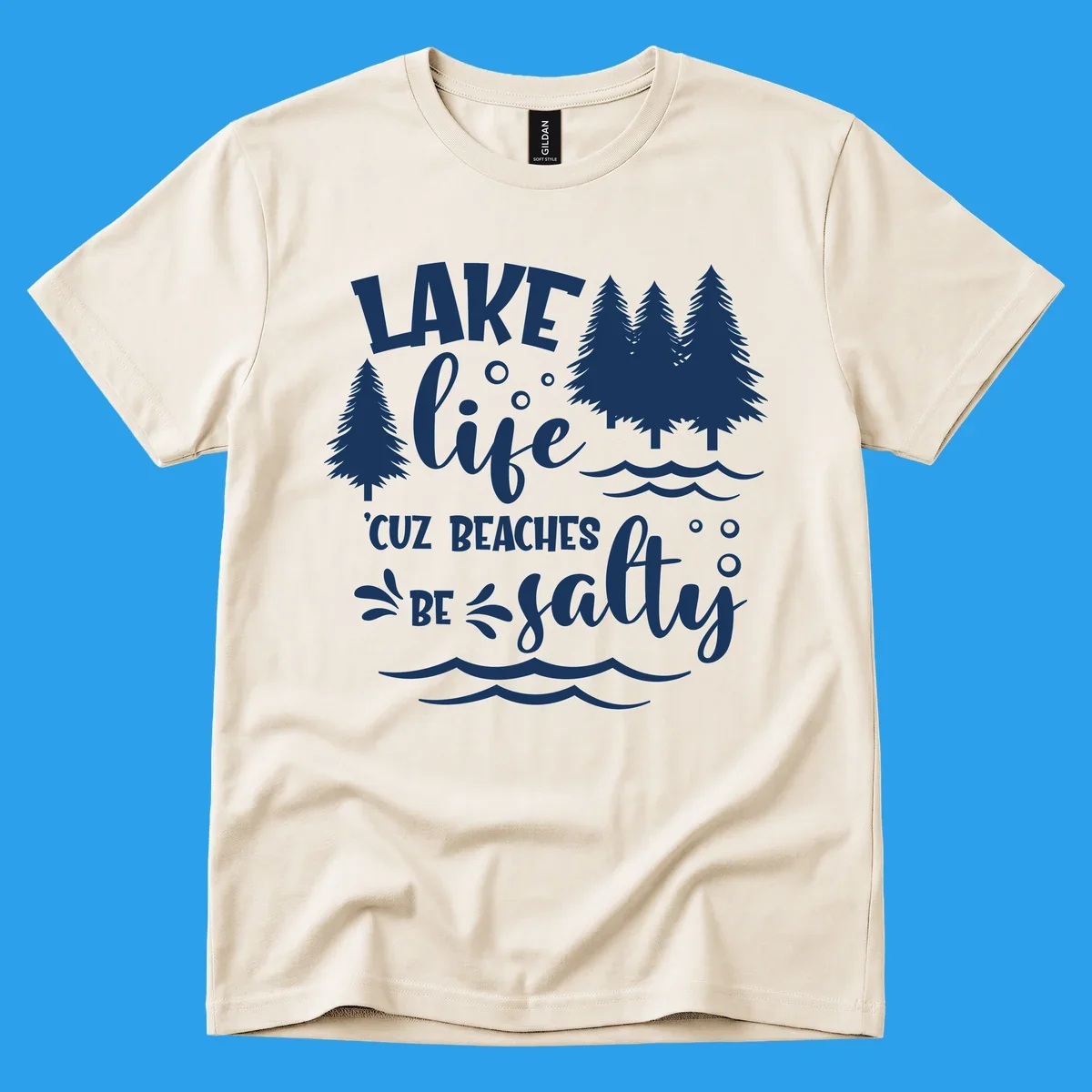 Lake life graphic with text 'LAKE life 'CUZ BEACHES BE salty', pine trees, and water waves.
