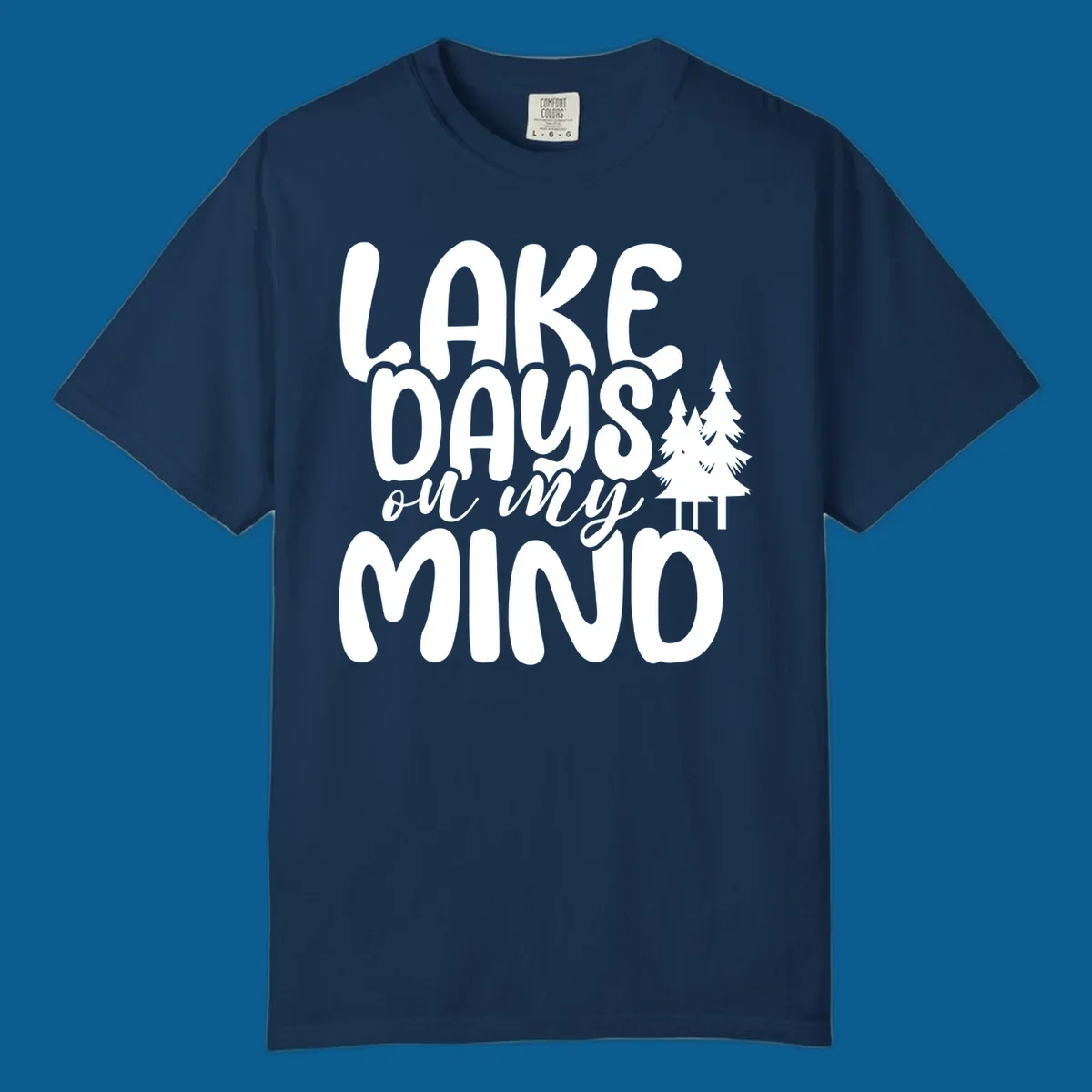 Lake days on my mind graphic with pine trees