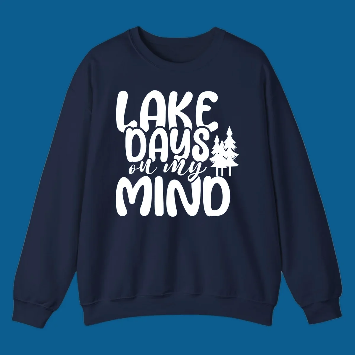 Lake days on my mind graphic with pine trees