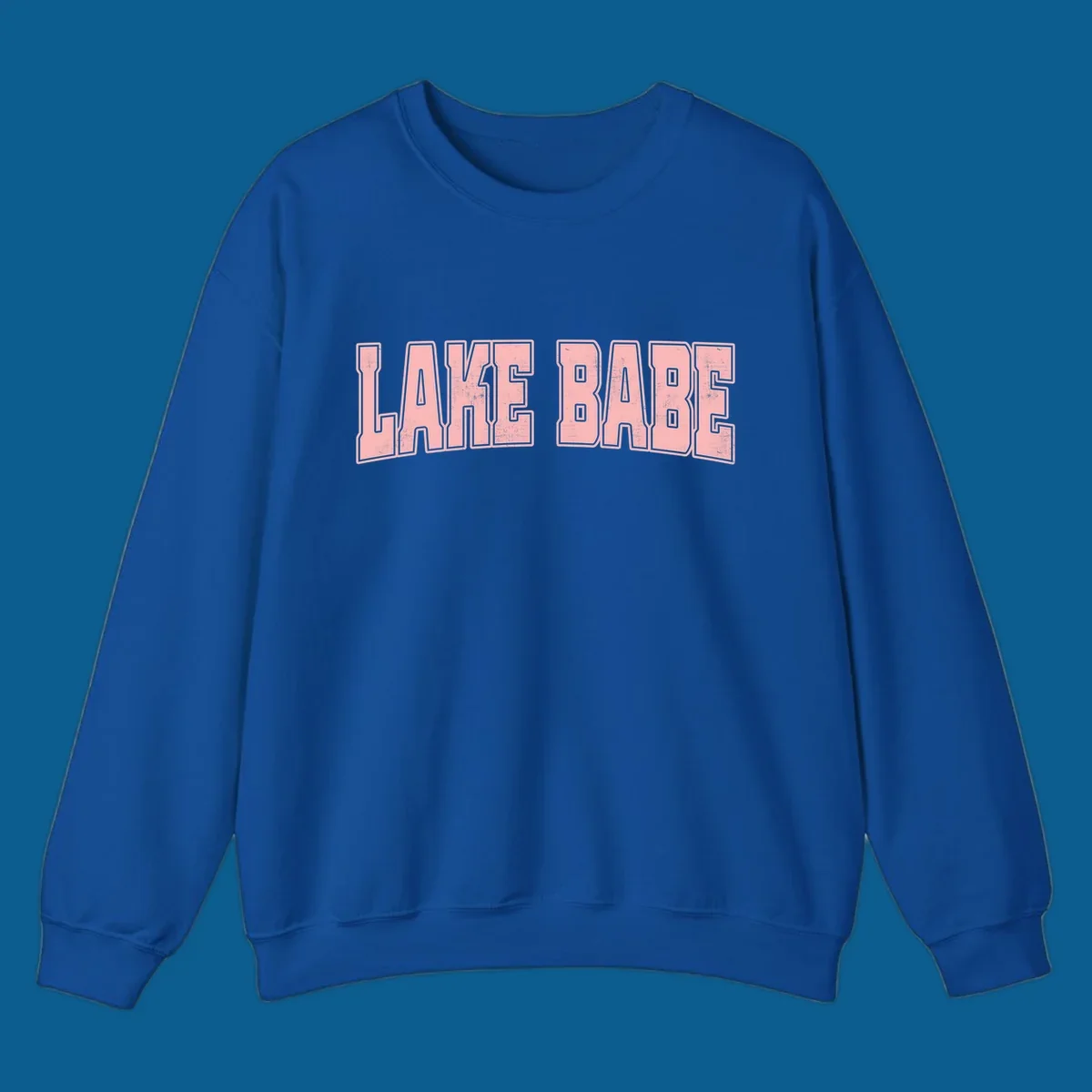 Lake Babe text design in pink with distressed texture and black outline.
