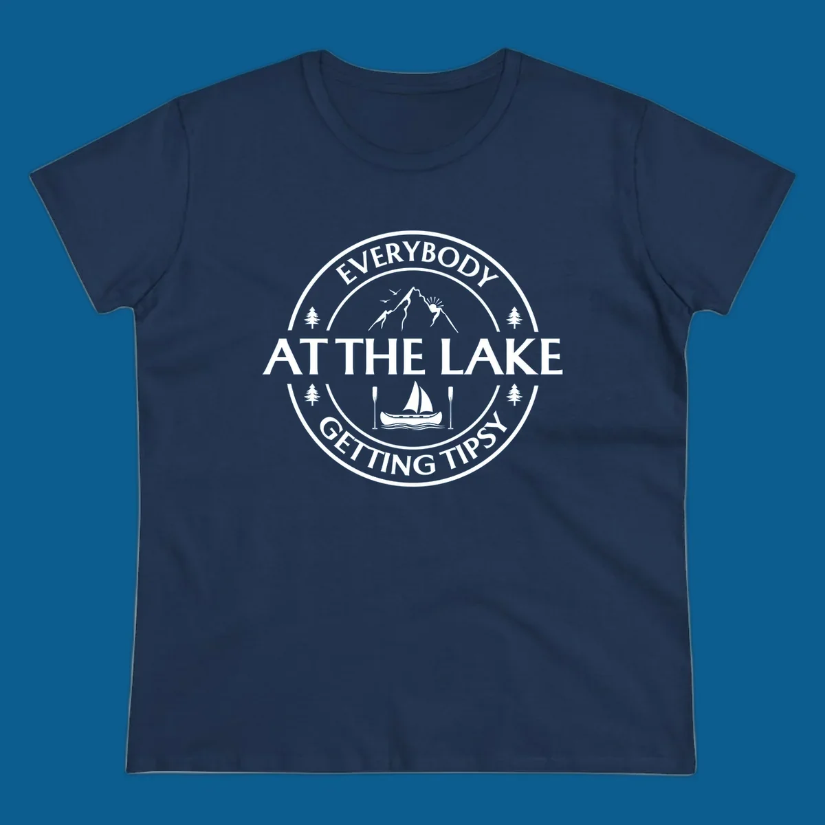 Circular badge design for lake life featuring mountains, canoe, and text 'Everybody At The Lake Getting Tipsy'.