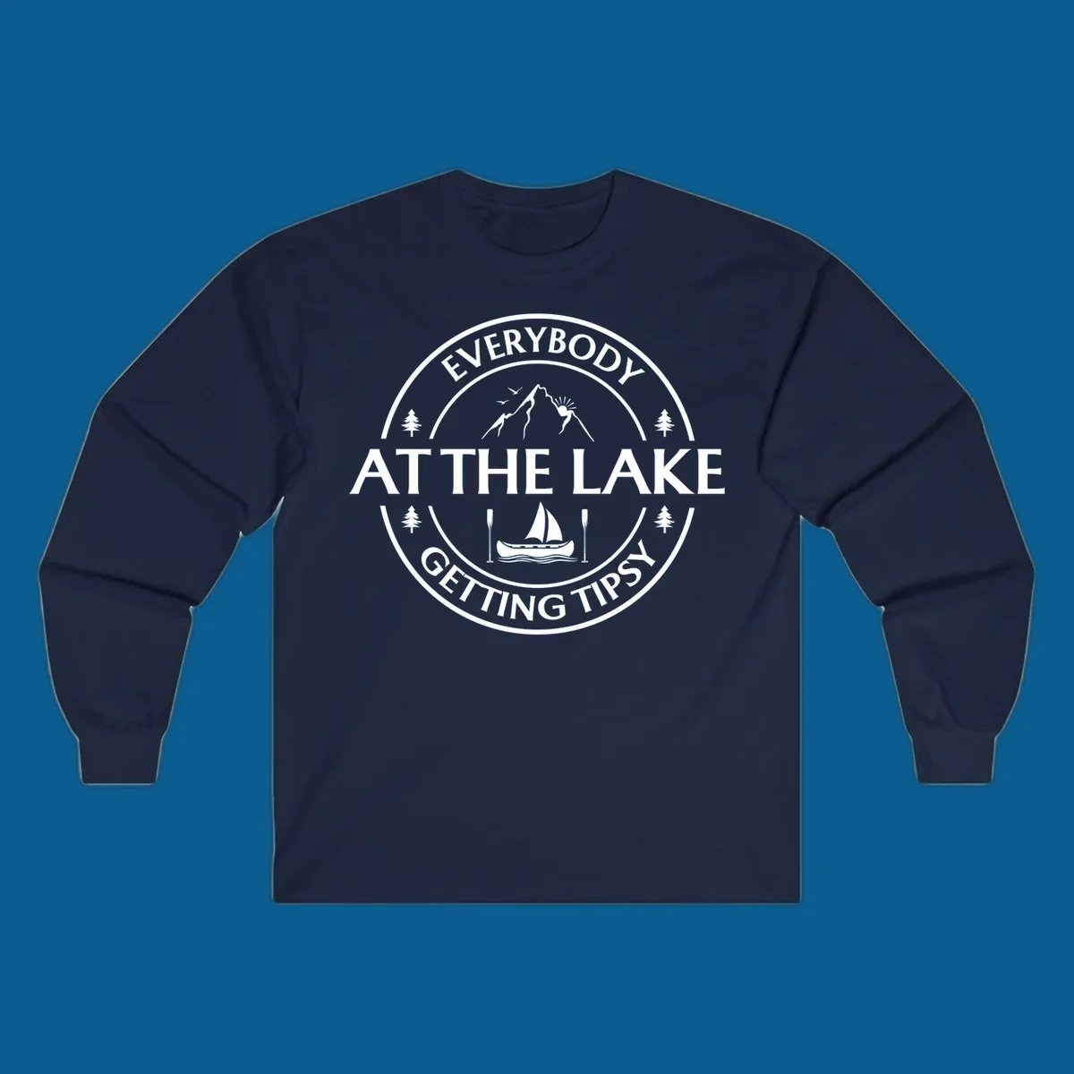 Circular badge design for lake life featuring mountains, canoe, and text 'Everybody At The Lake Getting Tipsy'.