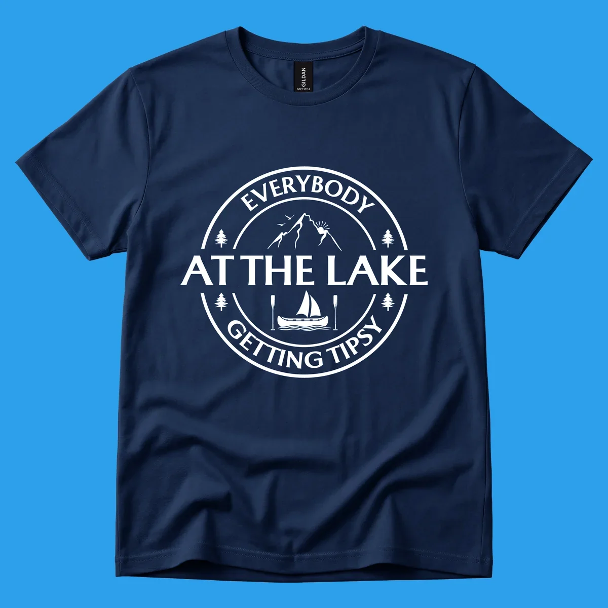 Circular badge design for lake life featuring mountains, canoe, and text 'Everybody At The Lake Getting Tipsy'.