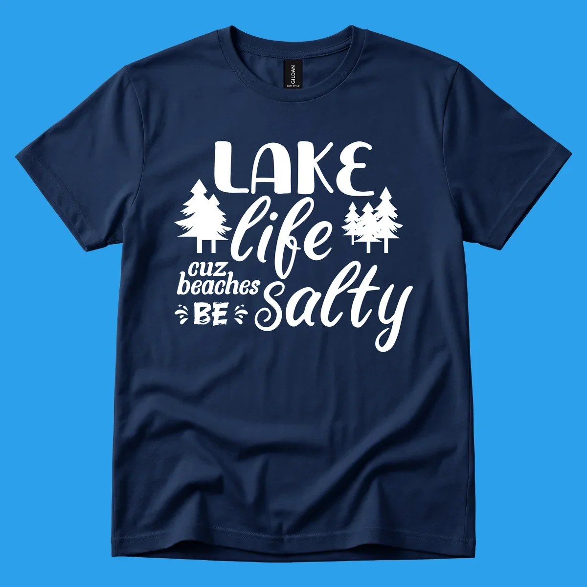 Lake life cuz beaches be salty text and pine trees graphic.