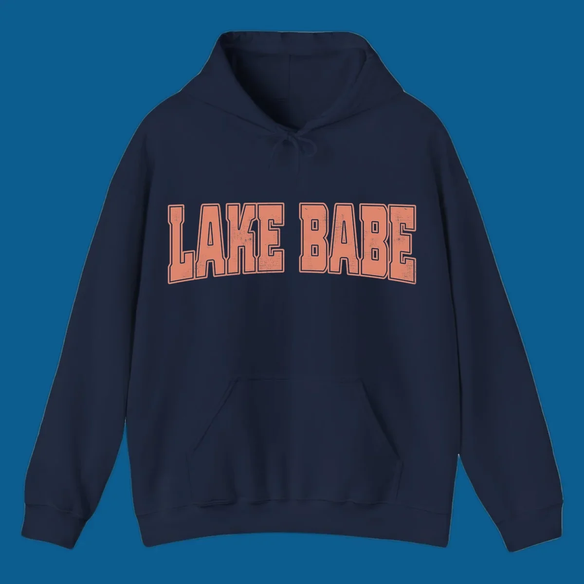 Lake Babe text in coral with distressed texture and thick outline, on black and white backgrounds.