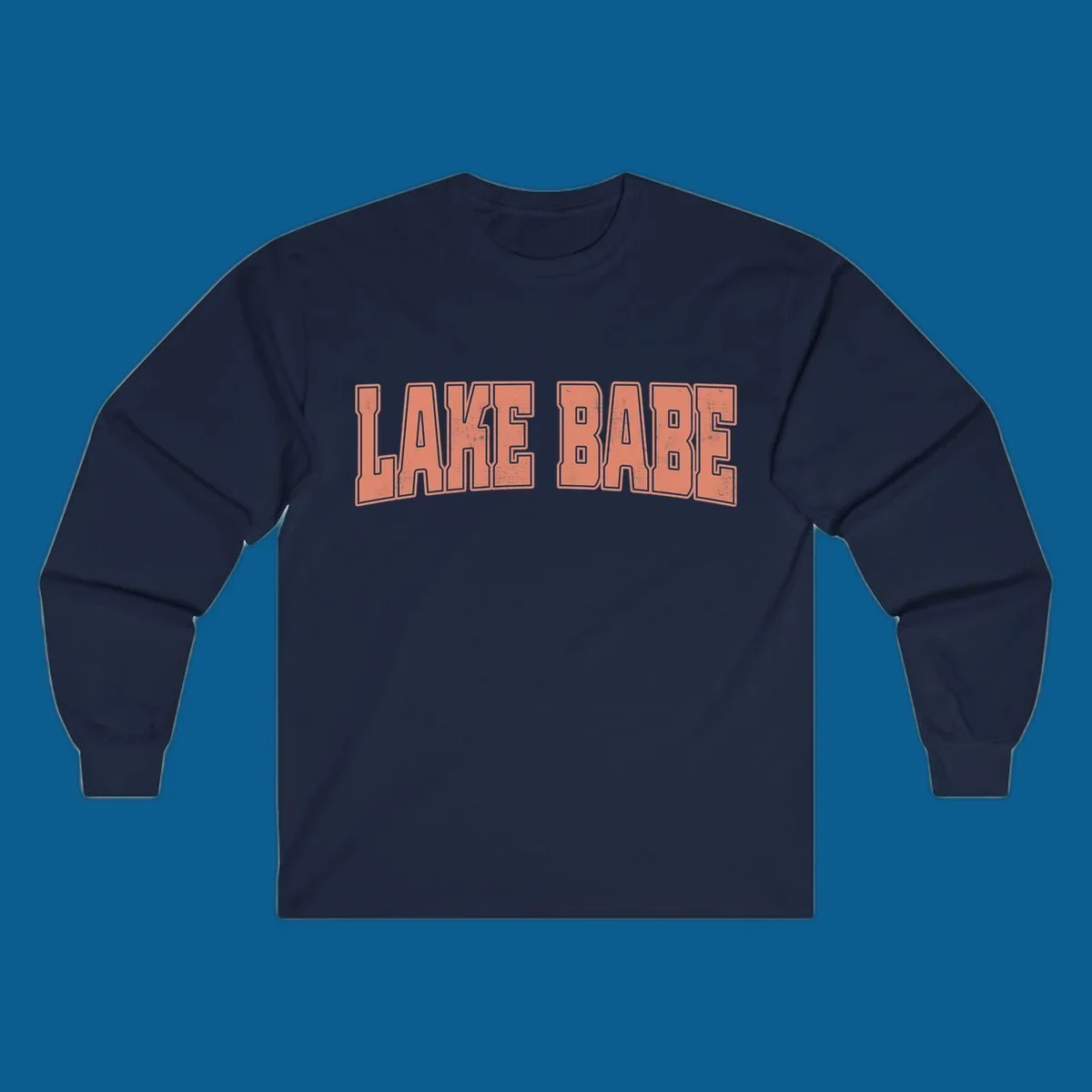 Lake Babe text in coral with distressed texture and thick outline, on black and white backgrounds.